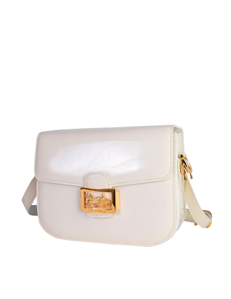 Celine Vintage Creamy White Patent Leather Gold Carriage Logo Flap Sho –  Amarcord Vintage Fashion