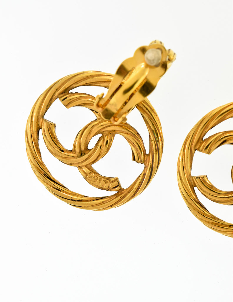A Pair of Vintage Gold-Toned Chanel '95 Logo Dangle Clip-On Earrings at  1stDibs  vintage gold chanel earrings, gold chanel dangle earrings, gold  chanel drop earrings